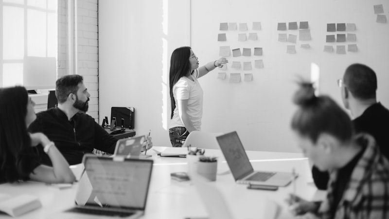 Vendor presenting at a whiteboard during a strategic partnership meeting