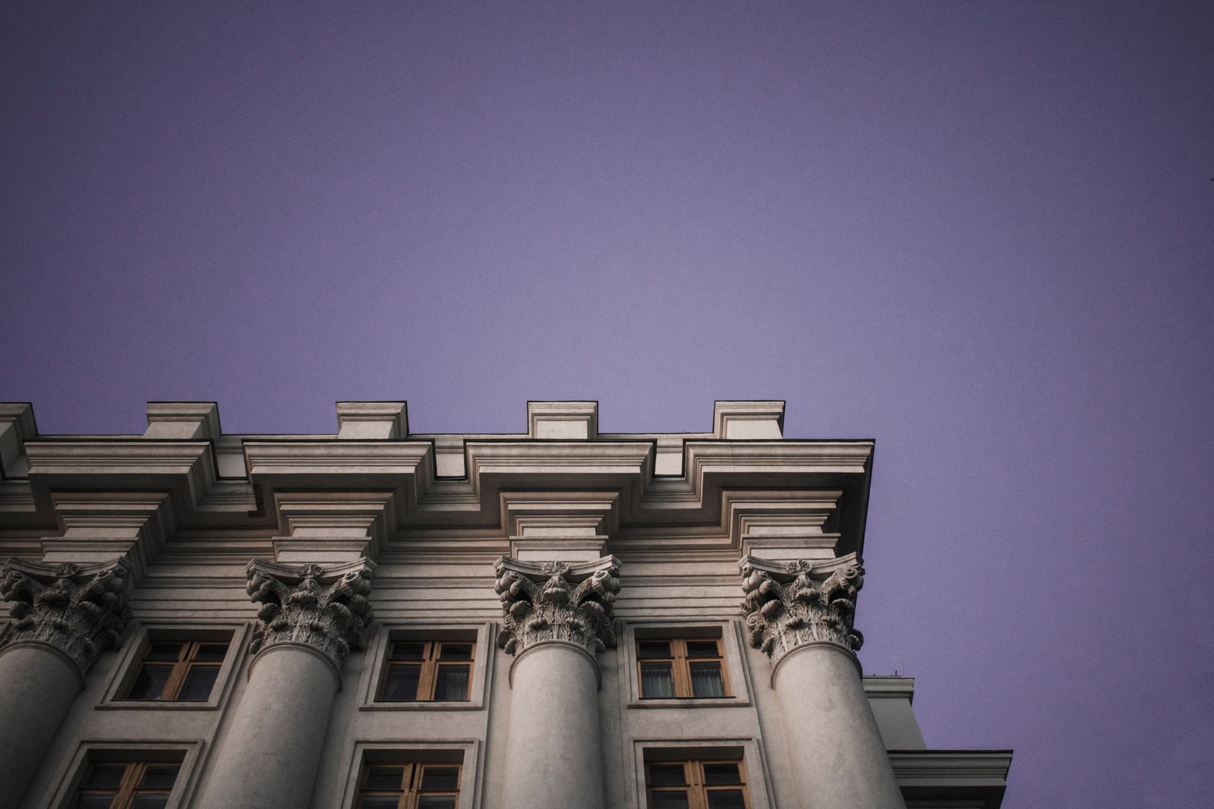 Stone columns of a government building at twilight