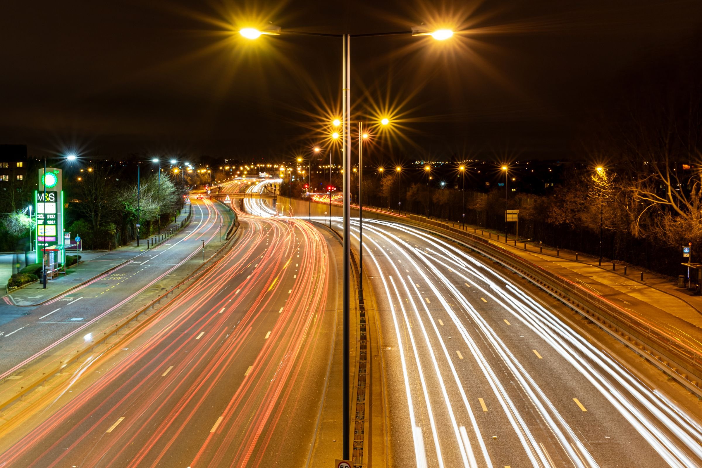 Light trails from traffic on a motorway at night